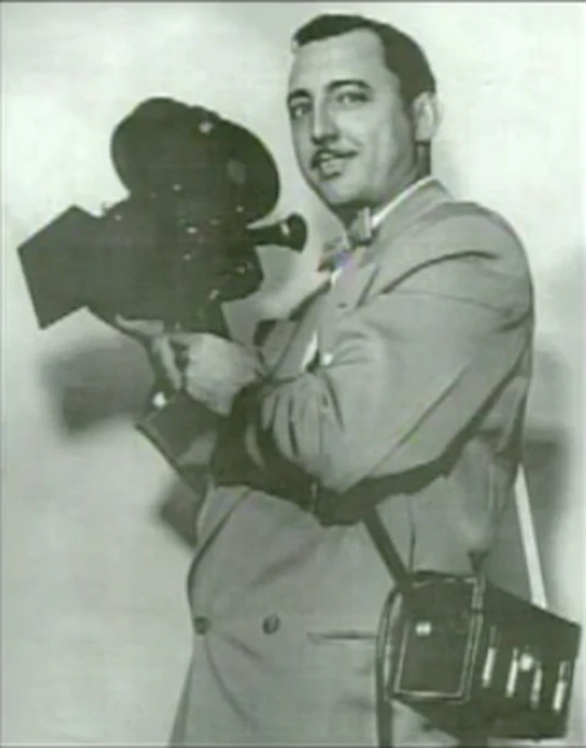 Juan E. Viguié Jr. with a film camera